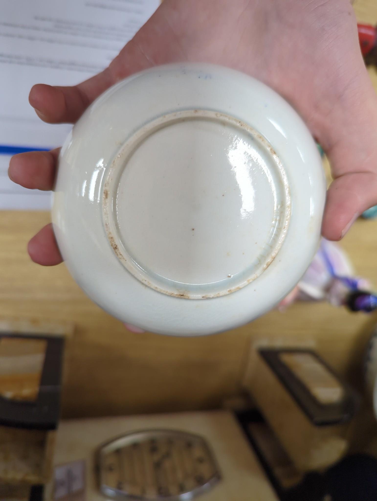 A large group of 18th century Worcester, Caughley and Liverpool blue and white tea bowls, coffee cups and saucers etc. including a Bow Cross-Legged Man